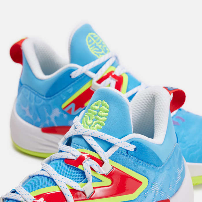 Detailed look at blue, green, and red New Balance shoes.